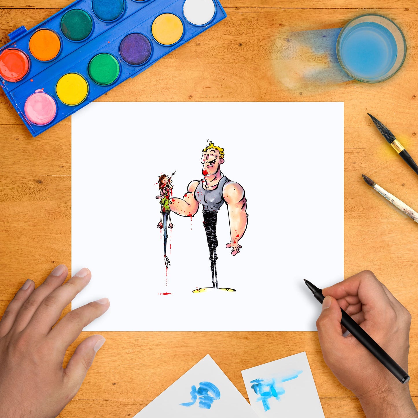 Original marker illustration of two cartoon characters, one with a tank top and black pants, and the other holding a knife. The artwork is displayed on a flat surface with a marker in hand, surrounded by paint pots and brushes.