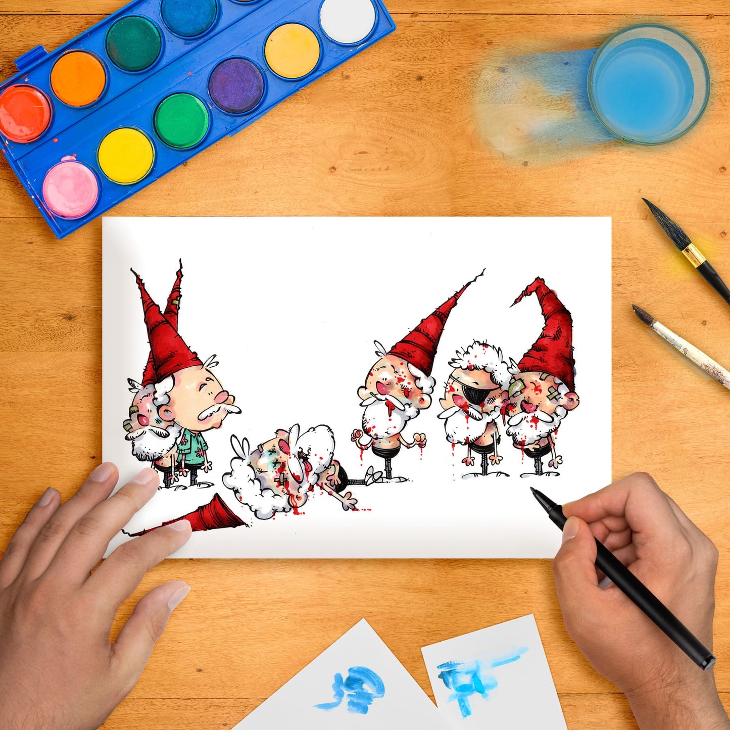 Original marker illustration artwork on paper depicting whimsical characters, placed on a table with art supplies around.