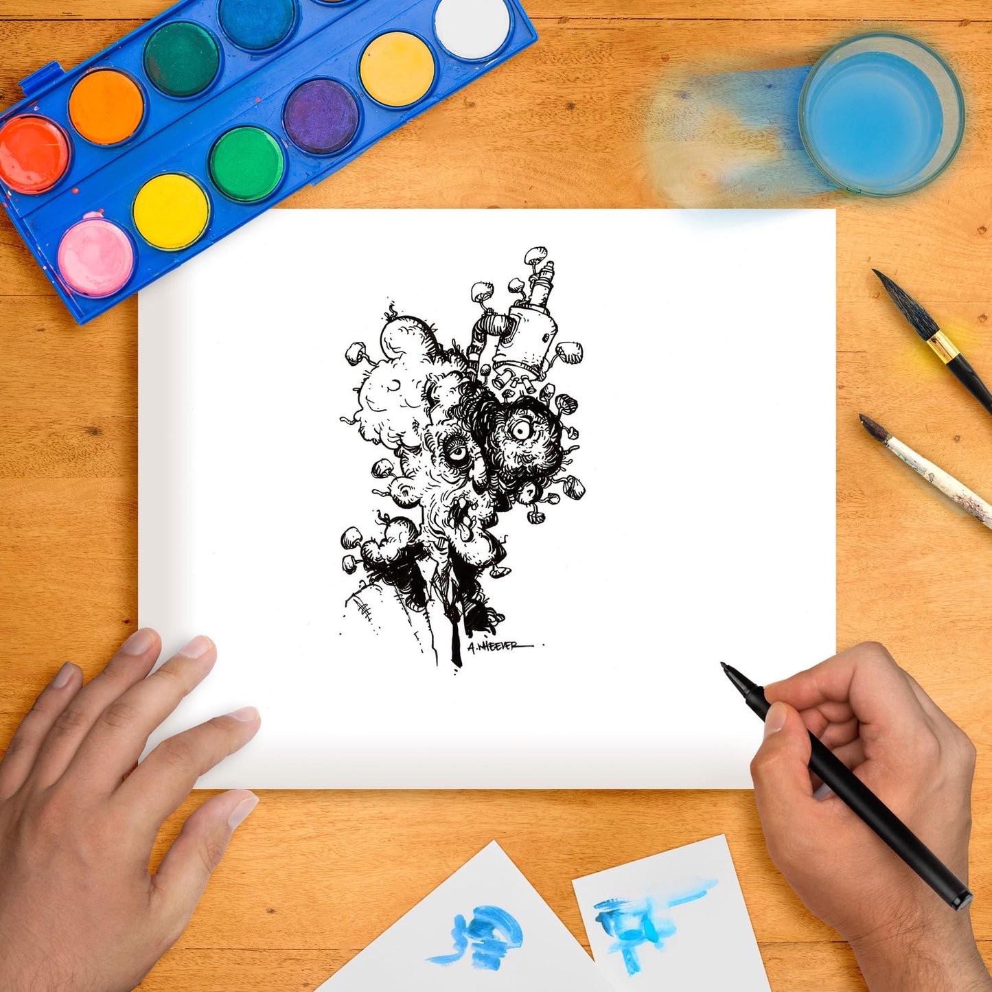 Original marker illustration artwork laid flat with artist's hands on the corners, showing a black and white image of a mushroom with scientific elements like a scientist and microscope, surrounded by colorful paintbrushes and watercolor paints.
