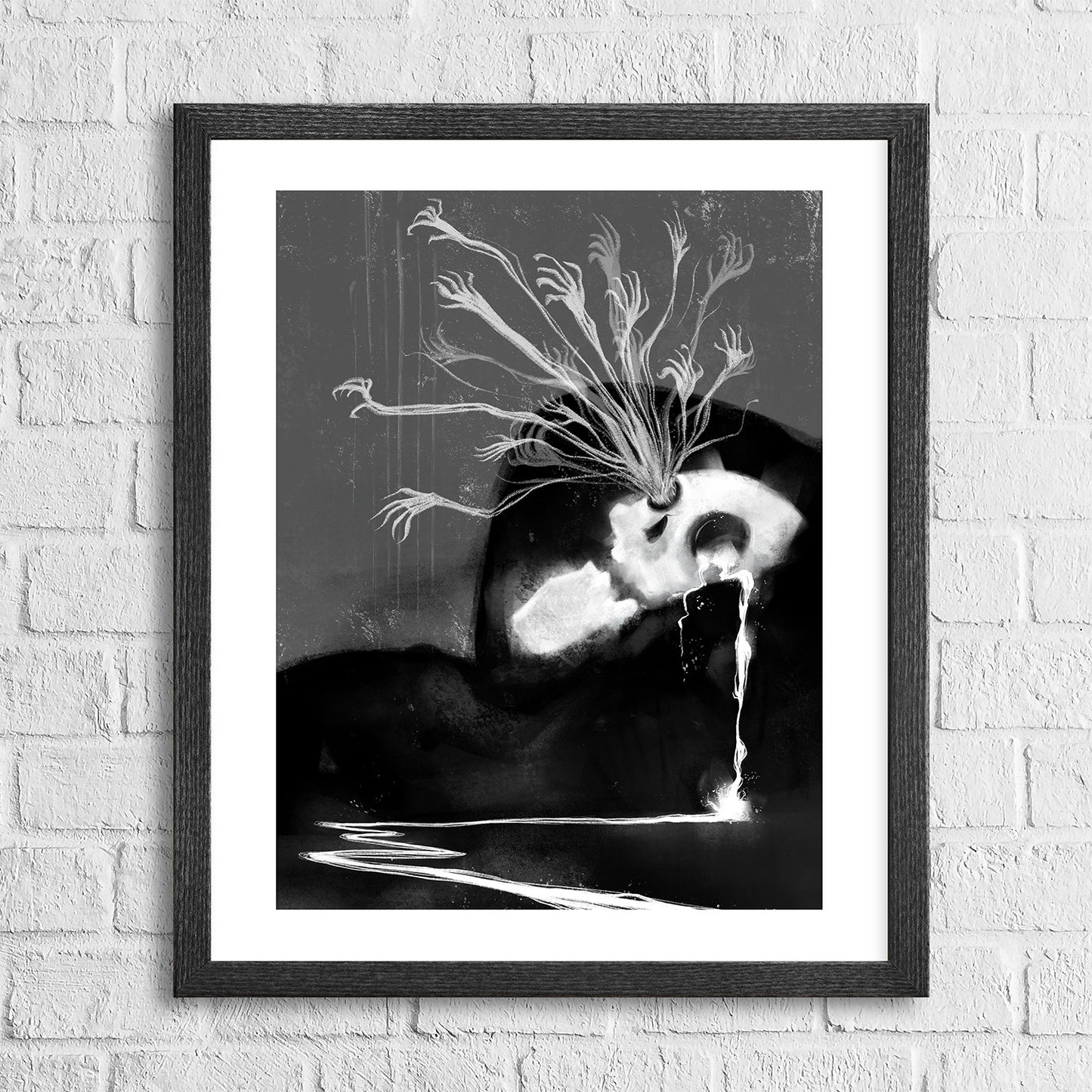 A black and white artwork of a skeletal reaper with ghostly tendrils, framed in a simple black frame, displayed against a white brick wall background.