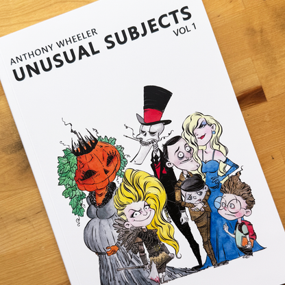 Anthony Wheeler’s Unusual Subjects Vol. 1 book cover featuring a colorful group of unusual illustrated characters on a wooden tabletop.