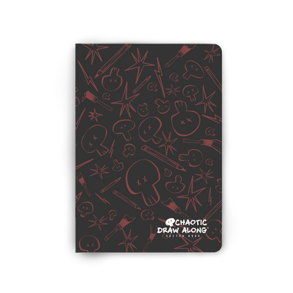 Front view of the black Chaotic Draw Along Sketchbook featuring a red skull-and-brush pattern.