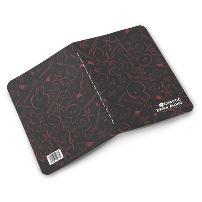 Black Chaotic Draw Along Sketchbook opened flat showing inside spread with matching red pattern.