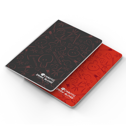 Stacked view of red and black sketchbooks with the black one on top.