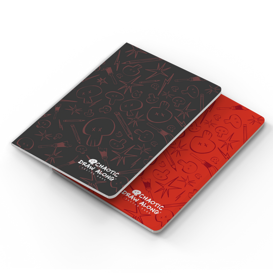 Stacked view of red and black sketchbooks with the black one on top.