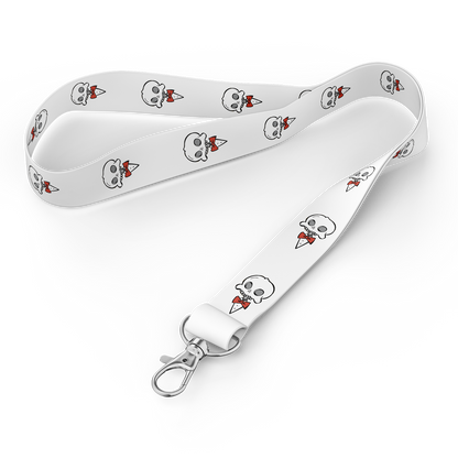 Full view of the Chaotic Draw Along white skull lanyard with repeating character artwork and metal clasp.