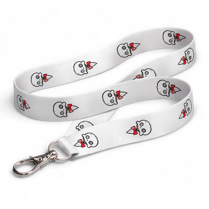 White Chaotic Draw Along skull lanyard with repeating red bow tie character artwork and silver clasp on a black background.