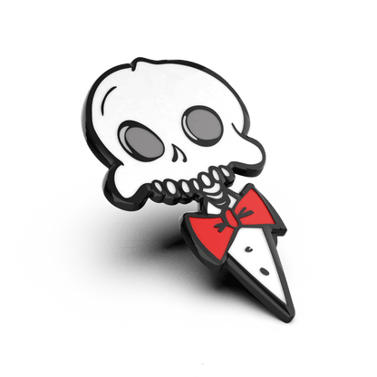 Enamel pin of a stylized skull wearing a red bow tie, designed in a cartoon style with bold black outlines.