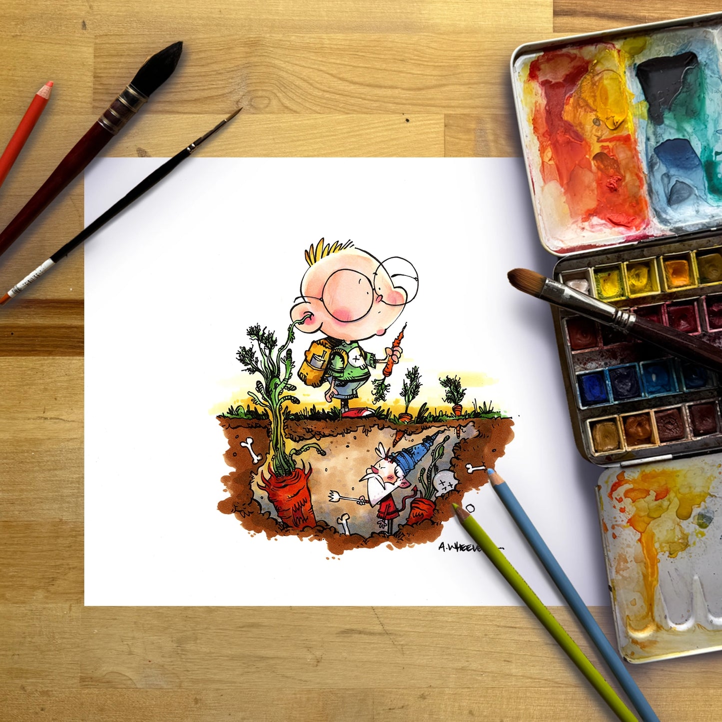 A cartoon-style illustration on a white sheet of paper showing a child standing on a patch of earth with plants and a rabbit under the soil, surrounded by paintbrushes, colored pencils, and watercolor paint palettes on a wooden surface.