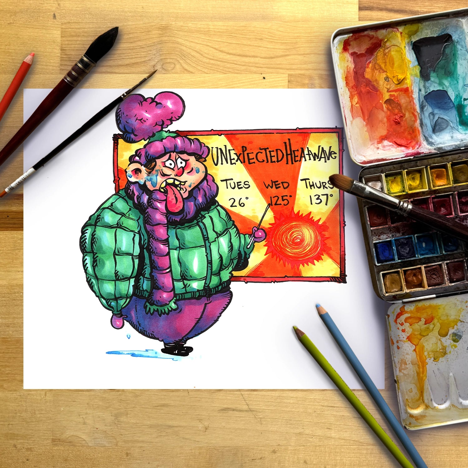 A colorful watercolor painting of a cartoon character in a winter coat holding a sign that reads 'UNEXPECTED HEAVEN' is displayed on a sheet of paper, styled on a wooden desk with paintbrushes, a watercolor palette, and colored pencils.