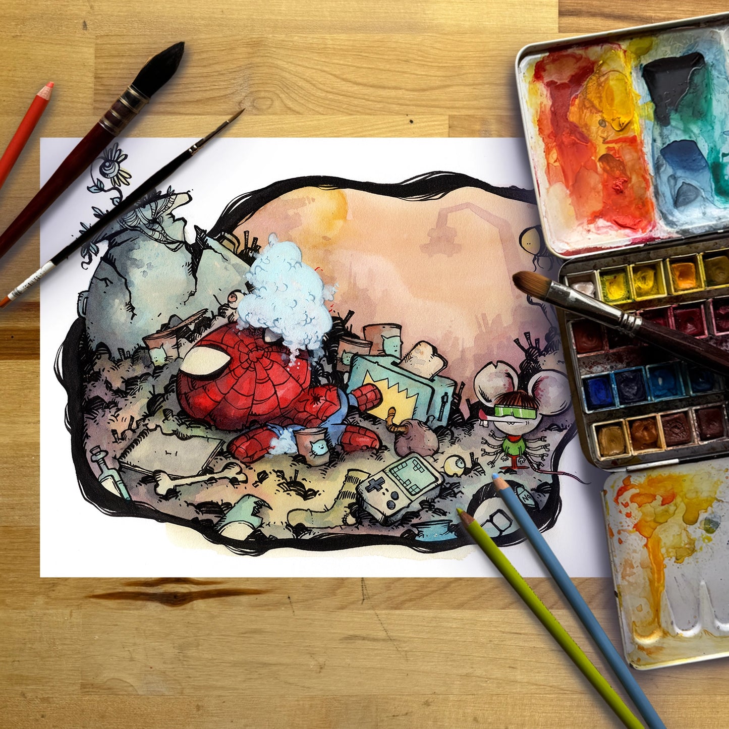 A colorful watercolor illustration of Spider-Man and a small spider-themed character in a messy room, displayed on a white sheet of paper on a wooden table with paintbrushes, watercolor paints, and pencils.