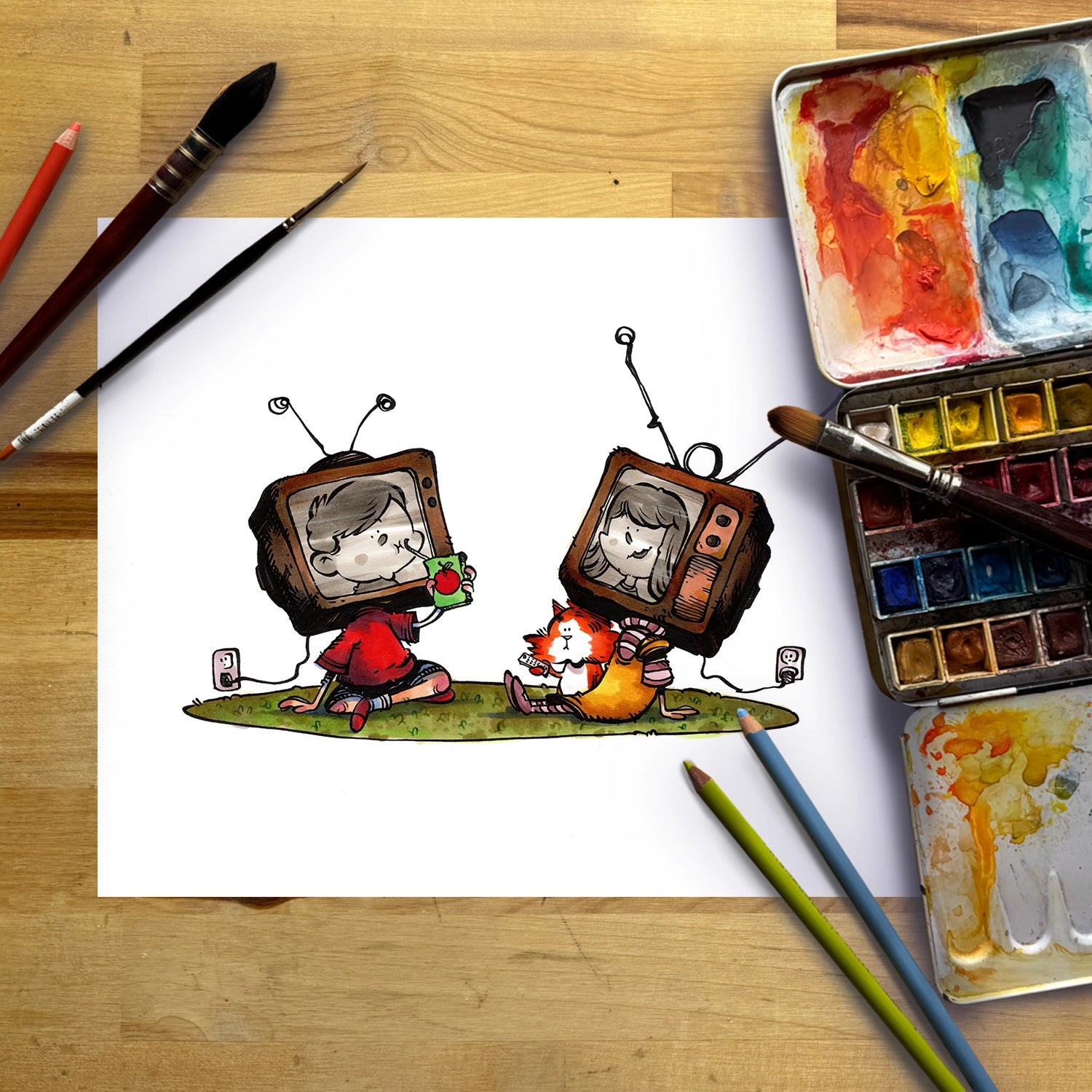A white sheet of paper on a wooden desk featuring a hand-drawn cartoon illustration of two children with retro television sets, surrounded by art supplies including paintbrushes, watercolor paints, and colored pencils.